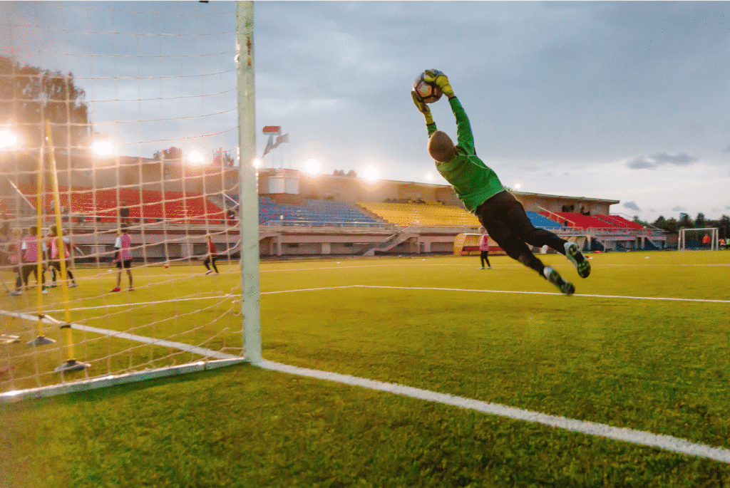 Young kid practicing dive save during goalkeeper training at 416 Soccer Club.